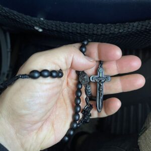 ROSARY IN PALM OF HAND